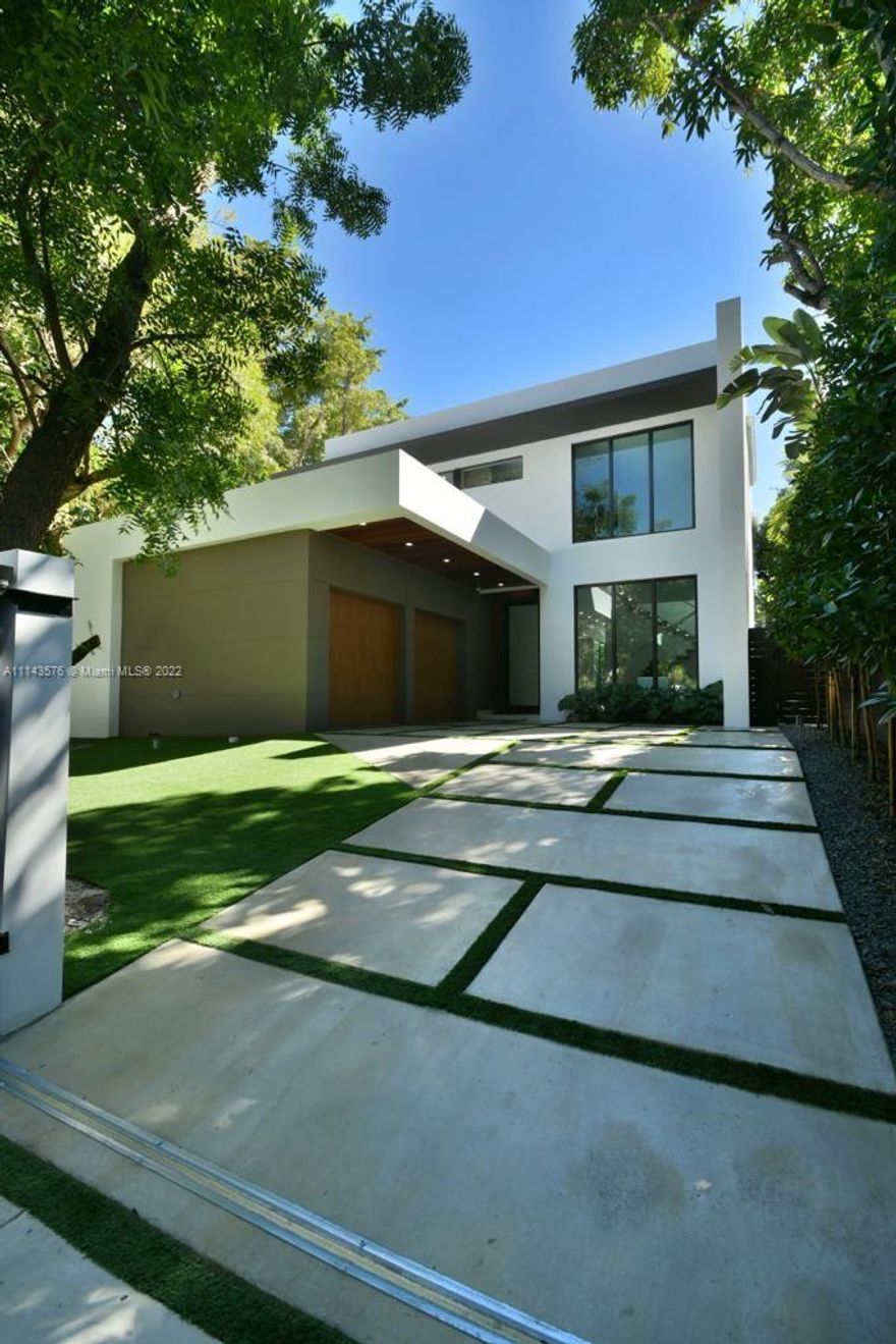 Thoughtfully conceived, elevated new-construction sited in one of the most desirable neighborhoods of North Coconut Grove. Totaling 5,100 total sqft. This beautiful house is a 5 bedrooms and 5 bathrooms. One bedroom is downstairs including a cabanabath. The house offers 12' ceilings with an elevator. The kitchen is an epicurean delight with top of the line apppliances (Sub Zero, Wolfe, and Miele). Heated salt-water pool with color LED lights, impact windows, wood floors, security cameras & custom lighting. The location is prime with great proximity to shopping & dining such as fresh market, Peacock park, Monty's raw bar and more.