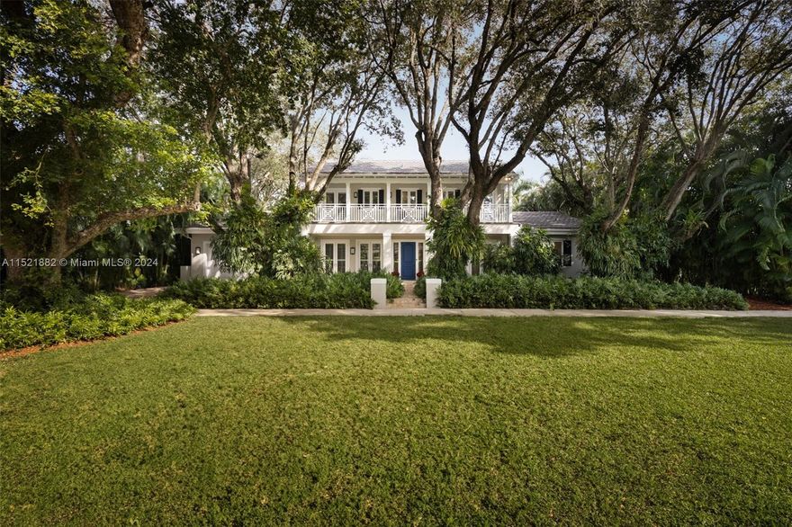 Built in 2011, this exquisite modern plantation-style home features top-notch finishes and 10-foot-high ceilings. Manicured gardens surround the 12,000 sq. ft. lot, and an impeccable interior includes Calacatta Gold marble countertops, white oak floors, and French doors that invite natural light. The primary bedroom offers pool and garden access, two walk-in closets, and a luxurious en suite bathroom. Upstairs, three bedrooms feature walk-in closets and en suite bathrooms. The home includes 540 sq. ft. of covered outdoor living space, a summer kitchen, and a heated pool with a waterfall. A two-car garage and the ideal location make this home the perfect family sanctuary that you have been looking for.