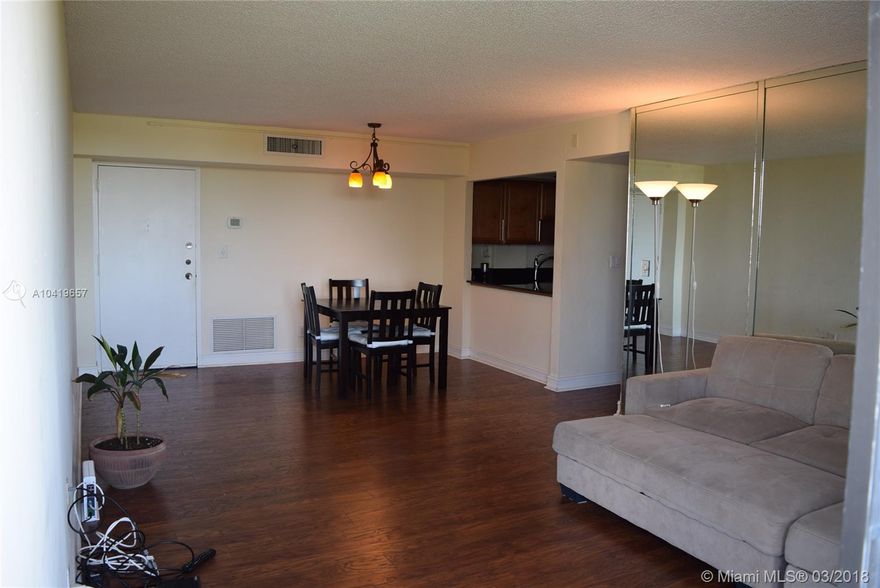 Completely updated 2/1 corner unit in one of the Grove's best boutique community's.  Granite counter tops , SS appliances, tile throughout, ample closet space.  Gated, secured community with over sized pool.  1 assigned parking with visitor parking.  Amazing sunset views from the balcony.  Unit comes with large storage closet in hallway. Loads of light in this wonderful corner unit. Laundry facilities on each floor.