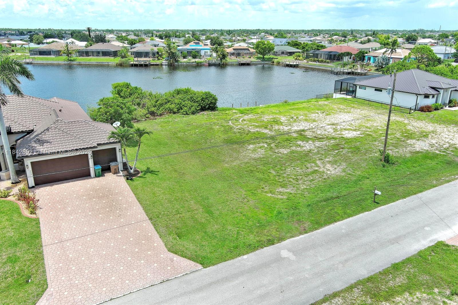 Exclusively presented by Sunland Real Estate: Discover the perfect blend of tranquility! This .23 acre lot is located on a desirable freshwater canal lot, offering beautiful backyard views and access to miles of scenic canals—perfect for kayaking, fishing, or simply relaxing by the water. The large lot provides ample space for a future pool or outdoor entertaining area, all with waterfront living. Located in a quiet NW Cape Coral neighborhood with easy access to shopping, dining, and parks. Ideal for full-time living, a seasonal retreat, or a rental investment. Don’t miss out on this slice of Southwest Florida paradise!