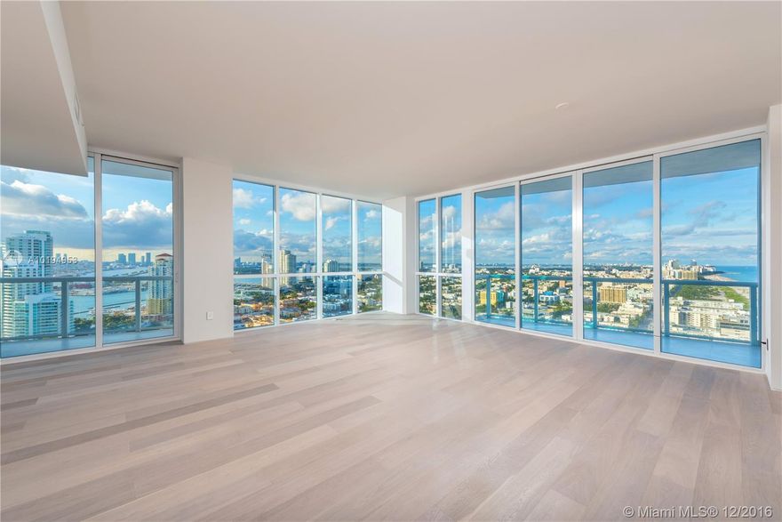 Inspired by the surrounding sand and ocean, designed with natural materials including oak wood floors, an integrated oak kitchen, travertine & oak bathrooms with corian vanities allowing an uninterrupted Atlantic Ocean, Biscayne Bay and Downtown Miami view to be the focal point. No expense was spared including floating walls and eight foot frameless Italian doors with dramatic wall washed mood lighting and the highest quality craftsmanship creating a truly sophisticated ambiance.