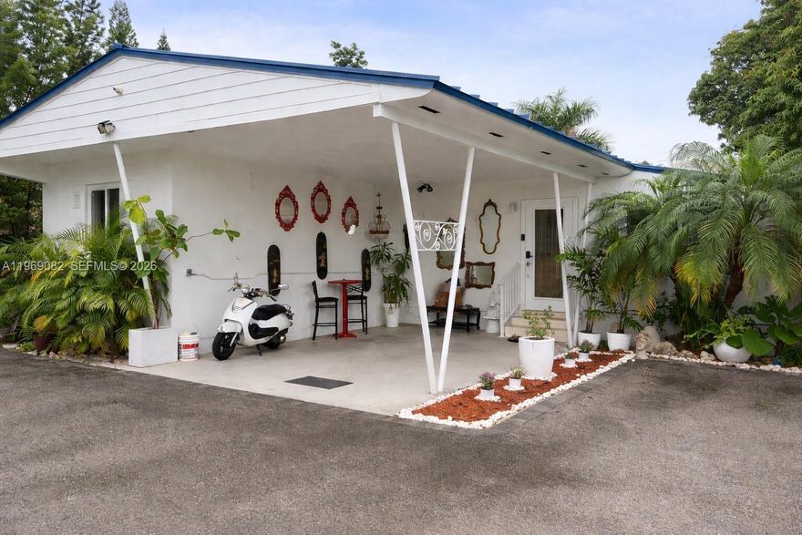 Canal-front property in Waldin Acres zoned Duplex (5700 – General) on approx. 8,875 sq ft lot. Recorded as a 3BR/2BA single-family home and upgraded with metal roof, impact windows/doors, new A/C, expanded covered terrace, custom outdoor kitchen/bar, detached storage, and privacy fencing. Currently configured with additional private-entry living areas with kitchenettes and bathrooms offering flexible use options. Configuration is not represented as separate legal units. Buyer to verify zoning, permits, square footage, and intended use. Large lot, waterfront positioning, and central Miami location near major highways, Downtown, and airport. Sold As-Is. Brokers welcome. Some photos have been virtually rendered.