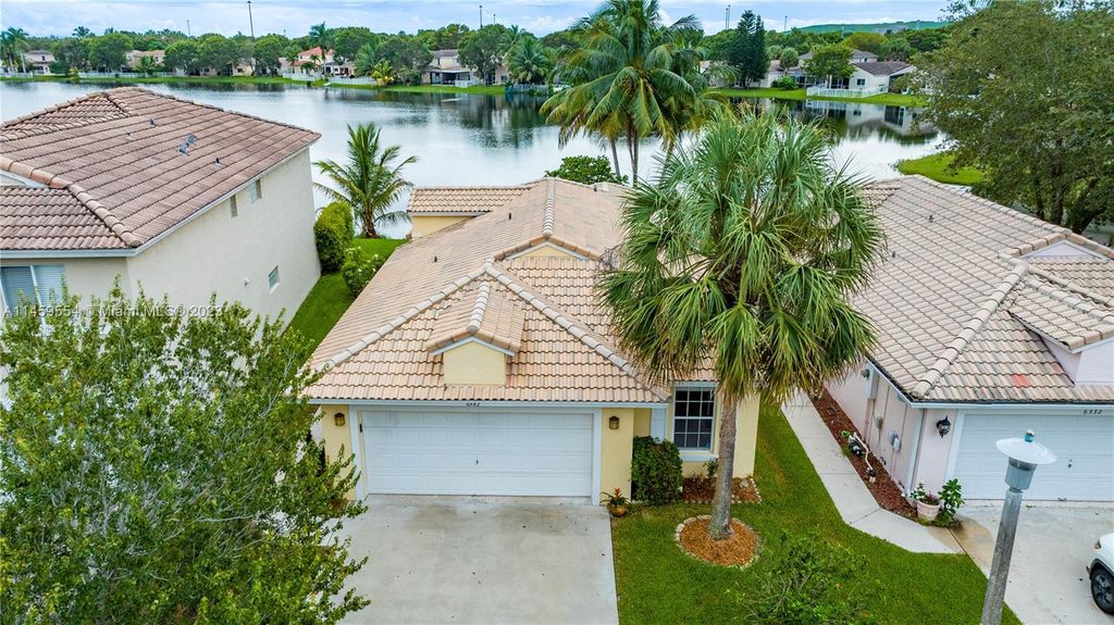 Photo of 6342 NW 40th Ave, Coconut Creek, FL 33073 (MLS # A11459554)