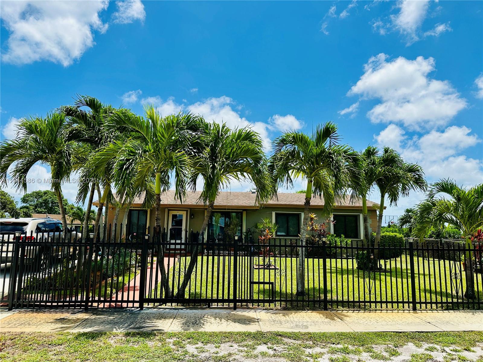 Lovingly maintained 3 bedroom and 2 bathroom home on a massive fenced in backyard located just minutes from the Hard Rock Stadium, Aldi, Walmart, and other major shopping centers. This residence features a newer shingle roof replaced in 2020, updated windows with shutters, updated kitchen and bathrooms, well maintained landscaping with fruit trees and much more! Plenty of parking space right at your door with ample space for boats and/or campers. Easy access to major highways, parks and public transportation. This property qualifies for FHA and VA financing. No HOA. Please do not disturb the owner.