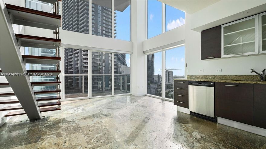 Beautiful corner unit two-story loft, open Master bedroom on the second floor. 2 private balconies. Extra large built-in walk in closet. Guest room and 2nd full bathroom on the first floor. washer and dryer in the unit. Spectacular views of the river and Brickell. Walking distance to shops and restaurants, Metro Mover, and market. Amazing amenities 2 level fitness center and more. *Loft-style floor plan. Second floor master bedroom is completely open (no walls). Second room on first floors has walls, door and private balcony.*