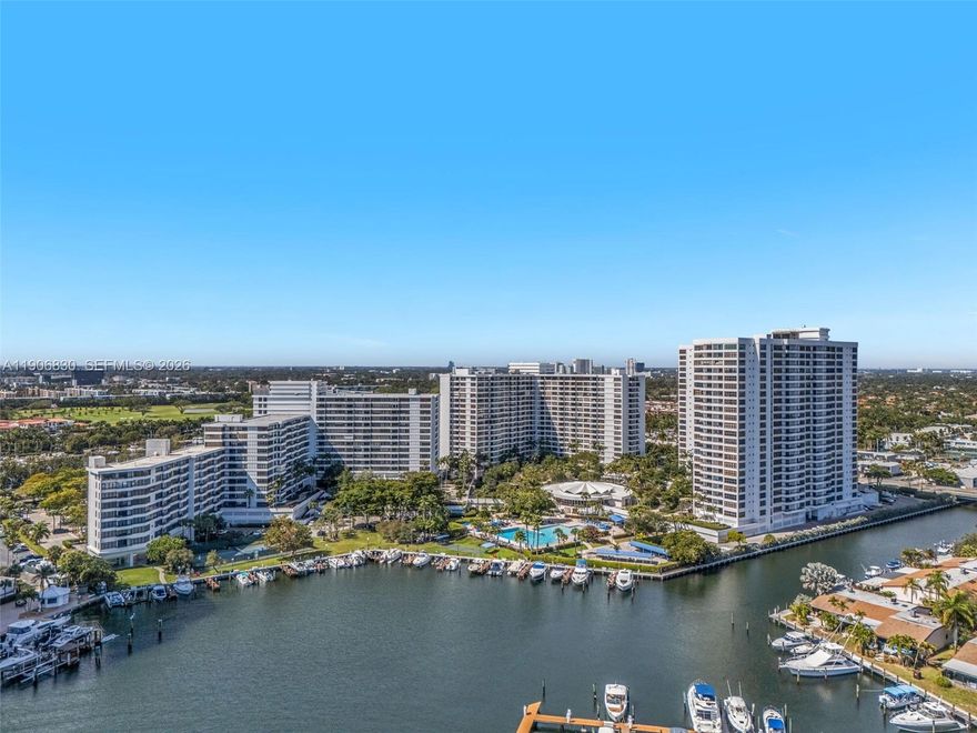 PRICE ADJUSTMENT!**See the virtual tour at 360 Matterport!**Discover a fantastic location in Hallandale Beach on Private Three Islands, surrounded by beautiful grounds. This 2-bedroom CONV, 2-bathroom, 1150 SQ. FT. unit offers an incredible view of the tropical pool area, marina, & Intracoastal Waterway. 
The split floor plan features high ceilings, a remodeled kitchen, wood floors, upgraded bathrooms, spacious closets, & a neutral color palette throughout. 
Amenities include tennis courts, heated pools, billiards, valet service, 24-hour security, a courtesy bus, gas grills, picnic areas, covered parking, & a great terrace. ANNEX UNIT.
You can easily walk to the beach, shopping, & more! A 24-hour notice is needed for showings. 
**See the virtual tour at 360 Matterport!**