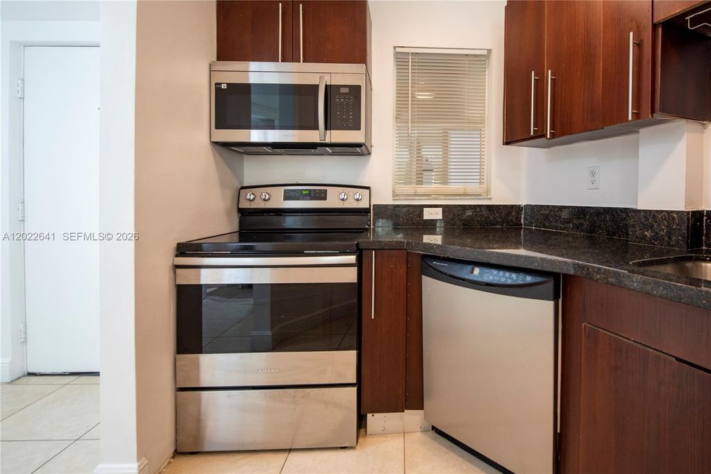 Photo of 4147 Stirling Rd #105, Dania Beach, FL 33314 (MLS # A12022641)
