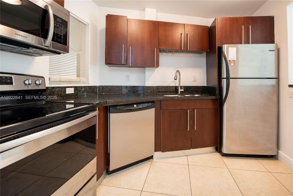 Photo of 4147 Stirling Rd #105, Dania Beach, FL 33314 (MLS # A12022641)