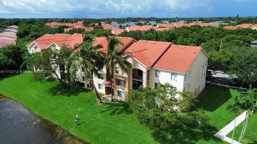 This beautifully maintained 2-bedroom, 2-bath split-plan condo is located in the sought-after gated community of Emerald Isles. Featuring an upgraded kitchen with stainless steel appliances, updated bathrooms, and tile floors throughout, this home is in pristine condition. Enjoy peaceful, wrap-around lakefront views right outside your door, along with resort-style amenities including a designer pool and clubhouse. The central location provides easy access to schools, shopping, dining, and is just minutes from I-95 and the Turnpike. Ideal for both comfortable living or as an investment property. Don’t miss this opportunity!----------UNIT RENTED TILL 12/31/2025, PAYS $1,900.00 PER MONTH - TENANT CAN SHOW THE UNIT WITH 24HS NOTICE