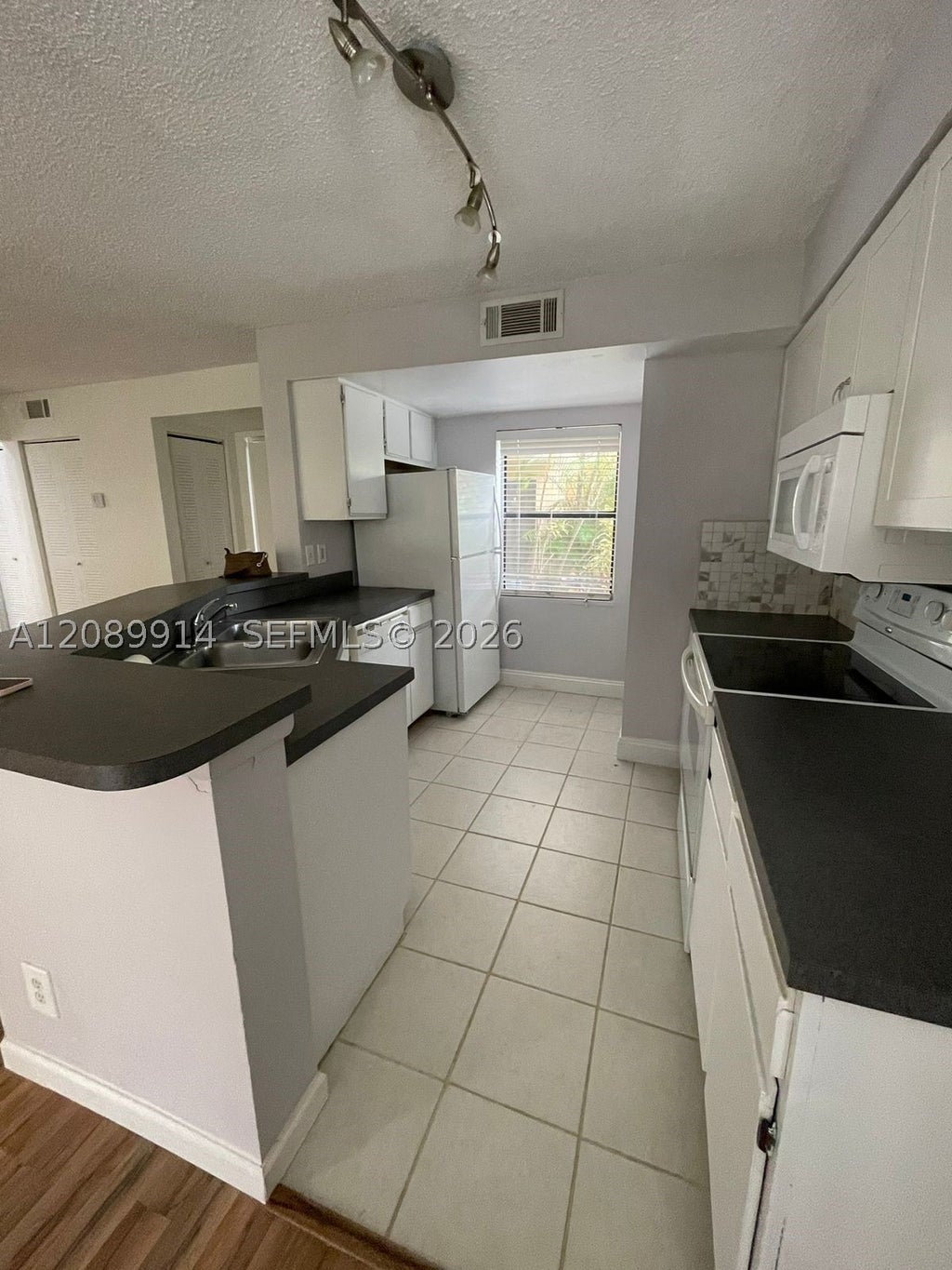 Photo of 9999 Summerbreeze Dr #413, Sunrise, FL 33322 (MLS # A12089914)