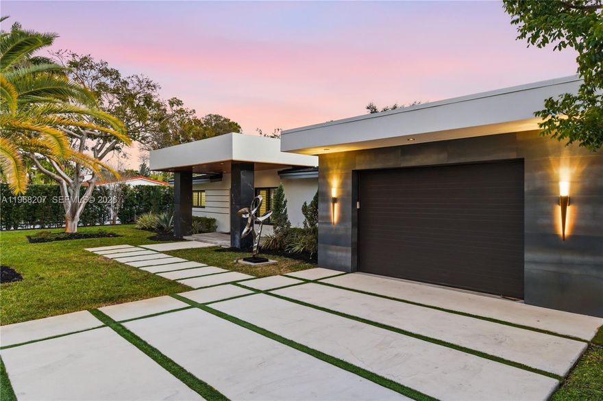 This extraordinary, one of a kind estate is an entertainer's dream, Fully renovated from top to bottom and enhanced by a 1328 sq. ft. addition bringing the total square foot to 3127 completed in 2021, Offering five bedrooms 5 baths and a private guest house with its own kitchen and rooftop terrace perfect for taking in breathtaking Florida sunsets. The moment you enter, Your eyes are immediately drawn to the all- inspiring backyard- An oversized, Lushly land Oasis featuring a spectacular, separate in ground hot tub, and a stunning view of the guest house that no Other property can replicate. Inside, the home boasts a gourmet chef's kitchen with high end appliances a summer kitchen seamless indoor outdoor living energy efficient impact windows and doors, porcelain tiled throughout the main Living areas hardwood flooring in the primary suite, and countless premium upgrades. Designed for those who appreciate luxury, privacy, and unforgettable entertaining, this residence stands truly in a class of its own.