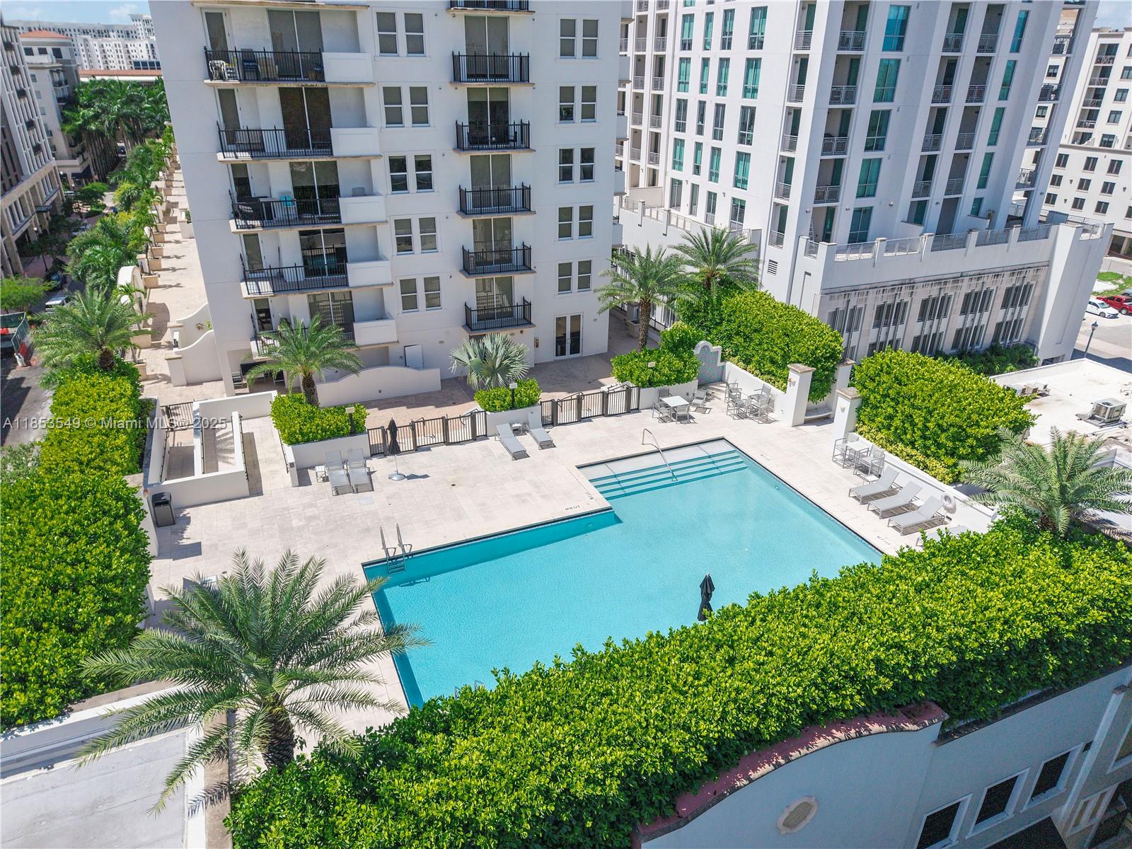 Welcome to One Village Place in the heart of Coral Gables—just 1 block from Merrick Park’s premier shopping and dining! This elegant 2BD/2BA condo features a bright, open layout with floor-to-ceiling impact windows and private balcony access. Unique to the 4th floor, this unit offers direct access to the building’s walkway—perfect for a morning stroll to the pool and gym without leaving the property. The kitchen boasts granite counters, stainless steel appliances, and wood cabinetry. The spacious primary suite includes a walk-in closet and spa-style bath. Enjoy resort-style amenities: pool, gym, sauna, and 24-hr concierge. Minutes to the University of Miami & Miracle Mile. Includes 1 covered parking. A MUST SEE!