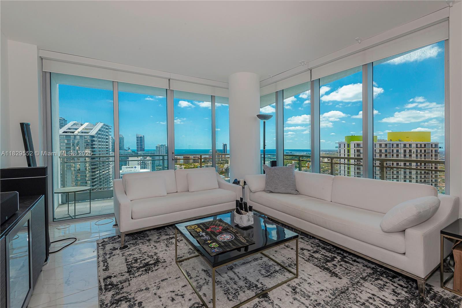 Stunning 2-Bedroom Sky Home on the 46th Floor! Welcome to luxury living at its finest! Perched high on the 46th floor, this immaculate 2-bedroom + Den, 2.5 bath residence is the best floor plan in the building—featuring a spacious, open split layout designed for both privacy and flow. Gleaming white marble floors run throughout. Enjoy seamless indoor-outdoor living with panoramic views and modern finishes. This premier building offers resort-style amenities, including a full-service spa, a recently updated fitness center, and a professional business center—all designed to elevate your lifestyle.