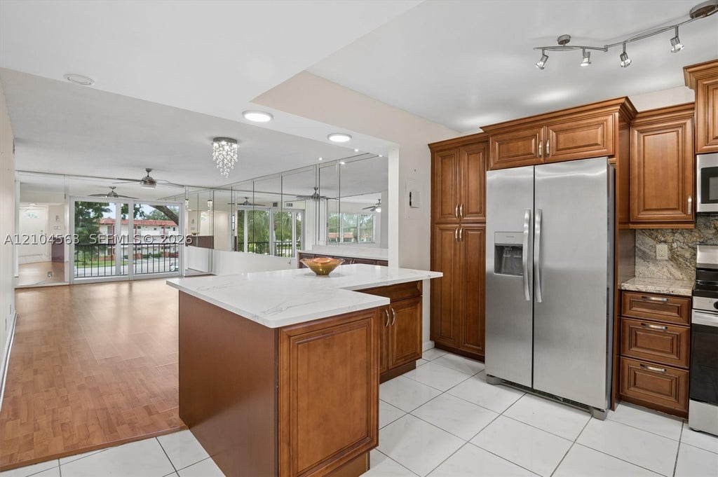 Photo of 8911 S Hollybrook Blvd #310, Pembroke Pines, FL 33025 (MLS # A12104563)