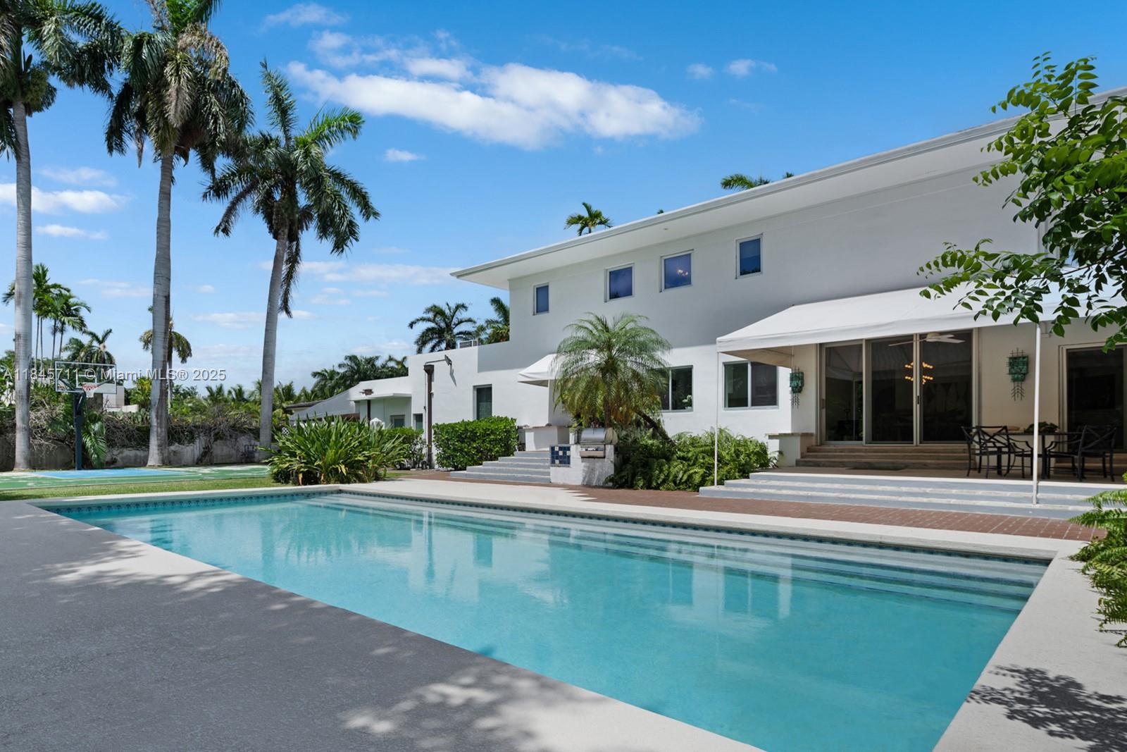 Step Inside With Me! This highly desirable corner double lot on the Venetian Islands includes 2 platted lots totaling 14,400 SF of land. Surrounded by lush tropical landscaping and soaring palms, this expansive property offers the potential to build a custom 7,200 SF estate or possibly 2 new construction homes on one of Miami Beach’s most coveted islands. The existing MiMo-style residence is filled with natural light and art deco charm featuring 4 bedrooms, wood floors, and interconnected living spaces. A glamorous pool setting, serene courtyard, and sports court define the grounds. Reimagine or redevelop this best in class property to curate a dream home. Unparalleled proximity to Sunset Harbour, the Design District, and the beach with $45M+ homes on San Marino Island raising your value.