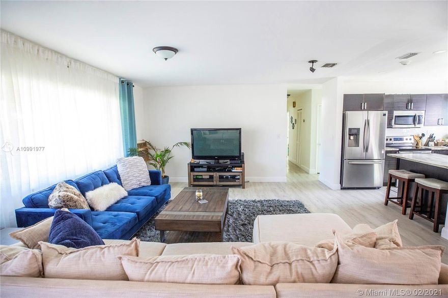 Beautiful opportunity to own this wonderful home on a massive corner lot! The home has a sprawling layout with great flow. A mix of new and original interior details create a unique style and atmosphere that feels cozy and comfortable. Impact hurricane windows and doors have been upgraded! Other updates include new flooring, fully remodeled kitchen and brand new central air system. The landscape is tropical, quiet and lush with lots of areas for relaxing, entertaining or exercising with space for a pool. Friendly neighbors and a safe and very family oriented neighborhood make this a great choice for families, couples and those looking to work from home! Also a great income property option with no rental restrictions! Just north of Miami Shores and west of Biscayne Park.