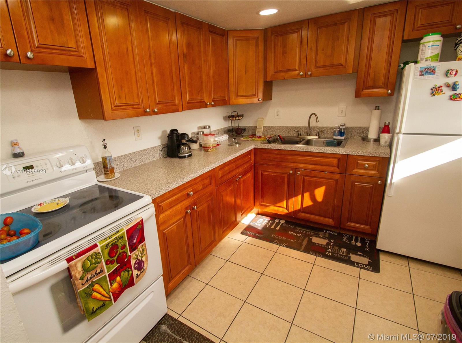 This is a rare chance to own a remarkably nice home in a well managed condominium. This home has 2 large bedrooms and 2-baths, and it has a newly remodeled kitchen and baths. The AC is newer. You'll be protected from hurricanes with accordion shutters. The windows were recently replaced. Easy to clean tile floors. You'll enjoy the view of the pool from the balcony, or going for a dip after a game of tennis. The monthly HOA fee of $407 includes payment for an assessment which was used for the building's 40-year certification. Existing excellent tenants will move prior to closing, or will continue as tenants if you're buying for rental. Most of these units are purchased for cash or using special financing.