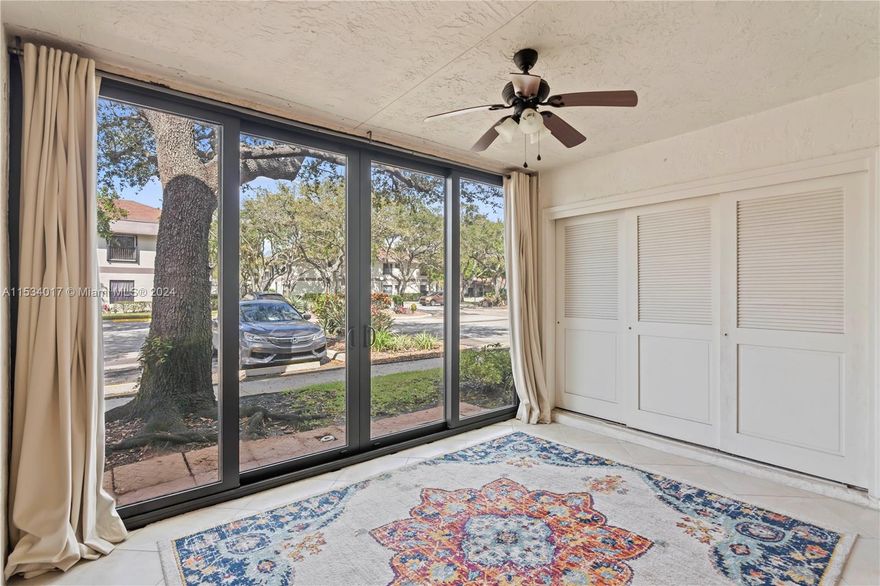 Charming 2 bed, 2 bath condo in Applewood Village III. Enjoy the convenience of impact sliding doors, washer, and dryer in-unit. This first-floor gem boasts freshly painted walls and brand new carpeting. Step out onto the enclosed patio just moments away from the community pool. Parking is a breeze with spaces right in front of the unit. Updates include a 2020 A/C unit and a 2022 water heater. Experience comfort and style in this move-in ready home.