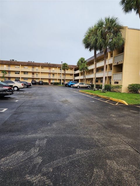 Photo of 5750 NW 64th Ave #303, Tamarac, FL 33319 (MLS # A12018605)