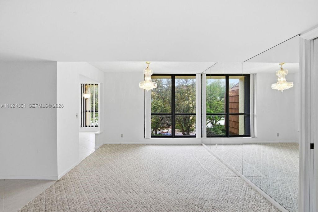 Photo of 5188 Woodland Lakes Dr #337, Palm Beach Gardens, FL 33418 (MLS # A11984351)