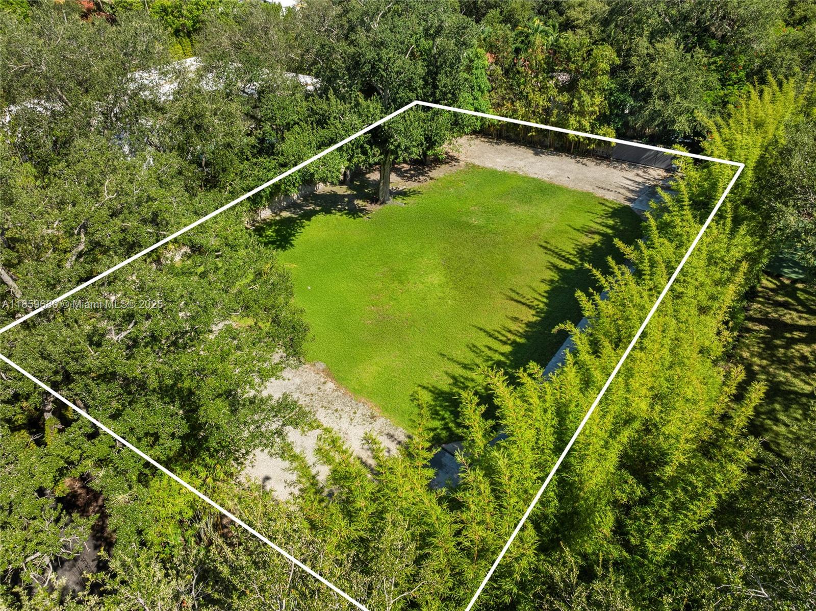 Located in the exclusive Ye Little Wood gated enclave in Coconut Grove, this pristine15,941 SF parcel of land offers the perfect canvas to build your dream home in one of Miami’s most coveted neighborhoods. The lot is fenced entirely by a coral rock stone wall has gated entrance at both ends for convenience & security. In addition to being part of the gated enclave, the back entrance has vehicular gate access to Midway Street, a public street not in the enclave. Concrete driveway runs the length of the property, connecting Little Avenue to Midway Street. Mature landscaping, large shade trees, elegant bamboo & ground lighting set a serene backdrop. Unparalleled Grove location-access to fine dining & shops, waterfront parks, marinas & top schools. A rare opportunity for refined Miami living.