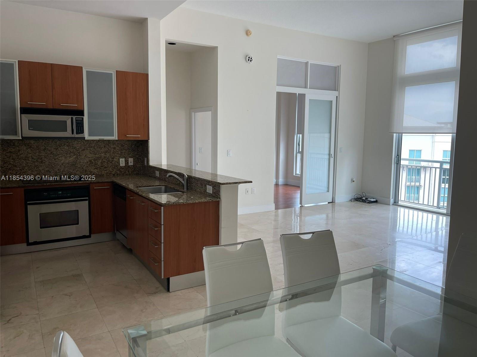 Experience urban luxury in this beautiful 1-bedroom featuring high 13-foot ceilings and expansive floor-to-ceiling
windows that flood the space with natural light. The open-concept living area boasts polished marble floors, while
the enclosed bedroom offers warm wood flooring and stylish sliding doors for privacy. The upgraded kitchen
features modern finishes and stainless steel appliances. Metropolis offers premier amenities including two resort style pools, a state-of-the-art gym, a party room for entertaining, and free valet parking for a second vehicle. Rent includes hot and cold water, basic cable, high-speed internet, and 24-hour security, ensuring a worry-free lifestyle.