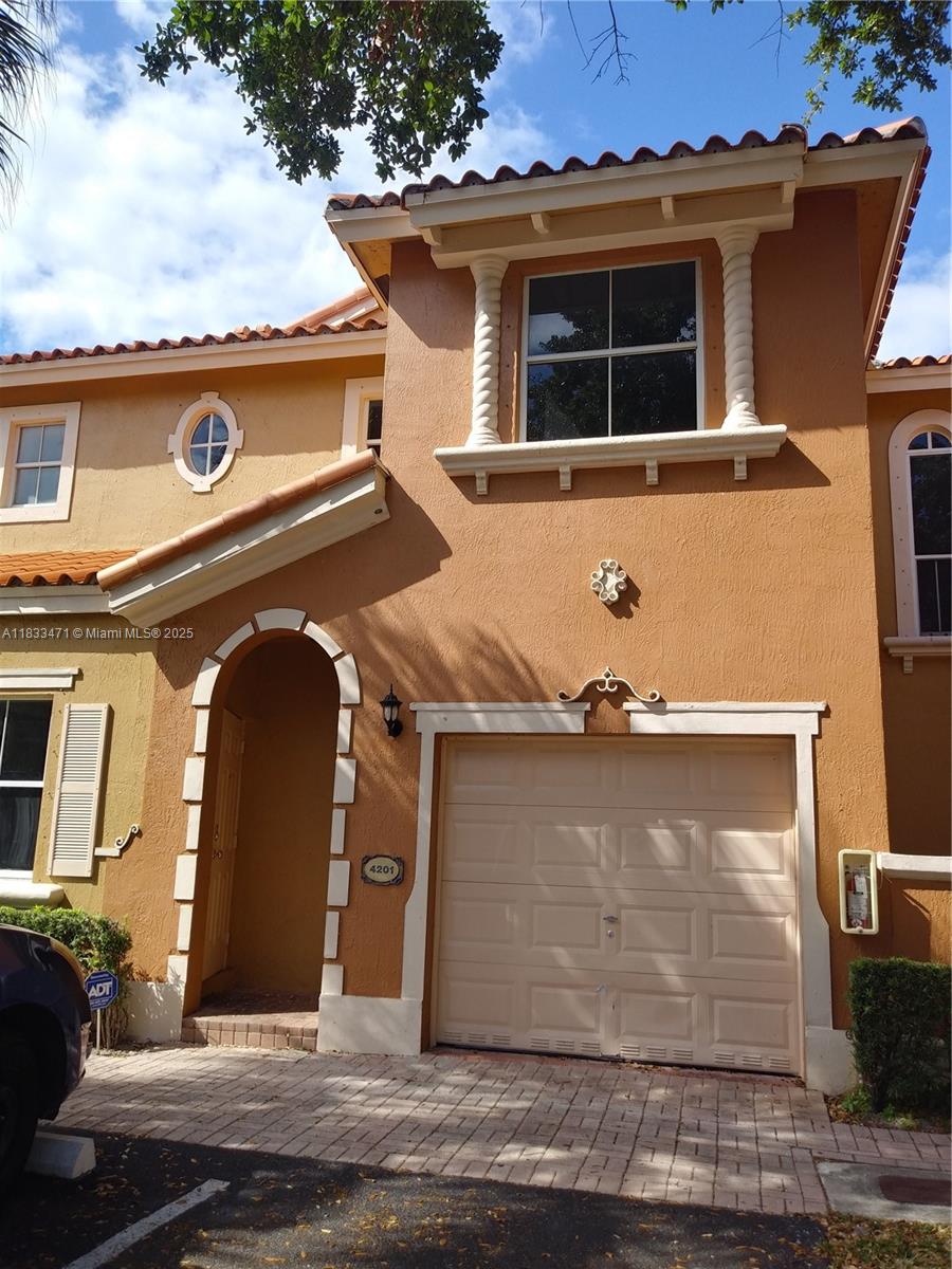 BEAUTIFUL TOWNHOUSE IN MIAMI LAKES AT VILLA VIZCAYA. CORNER UNIT HAS 3 BEDROOMS, /2.5 BATHROOMS, 1 GARAGE (The garage is closed and transformed into a playroom. Also can be used as an office or a guest room), STAIN STEEL APPLIANCES , WASHER & DRYER INSIDE THE UNIT, PRIVATE PATIO, TILED IN BOTH FIRST AND SECOND FLOOR. COMPLEX HAS SECURITY, HUGE POOL, KIDS PARK AND CLOSE TO SHOPPINGS, MAJORS HIGHWAYS & EXCELLENT SCHOOLS. This unit is in the process of being painted and deep cleaned. The association only allows two cars per unit, without exception.
