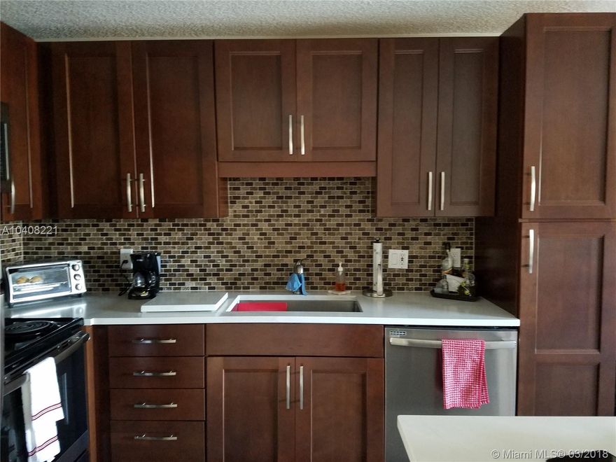 Spectacular corner Town home with new kitchen with stainless steel appliances and granite counter-top, beautiful tile floors at the bottom and wooden Flores upstairs , nice family room and living room.fenced back yard for entertainment. has 2 assigned parking spaces. property in excellent conditions in the heart of Kendall.  per owner sale will contingent on buyer finding a place to move with in a reasonable time.