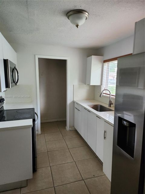 Photo of 2837 NW 9th Ct, Fort Lauderdale, FL 33311 (MLS # A12006901)