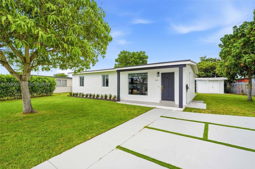 Beautifully renovated and move-in ready, this modern residence offers a clean, bright aesthetic with high-end finishes throughout. The open-concept layout features sleek porcelain floors, recessed lighting, the living and dining area flow seamlessly into a contemporary kitchen with white cabinetry, quartz countertops, stainless steel appliances, and a large island perfect for entertaining. Both bathrooms have been tastefully updated with double vanities, and elegant gold fixtures.  A dedicated laundry room with custom cabinetry adds convenience and functionality. Step outside to a private backyard designed for entertaining, featuring a covered patio with wood accents, built-in barbecue grill, prep area sink, and ample seating space. The property also includes a full pickleball-style court, offering a unique and highly desirable lifestyle feature rarely found in this price range. Additional highlights include impact windows/doors, modern lighting throughout, and a spacious yard with room to further customize.
Centrally located with easy access to major highways, shopping, dining, and schools such as St. Brendan and Columbus.