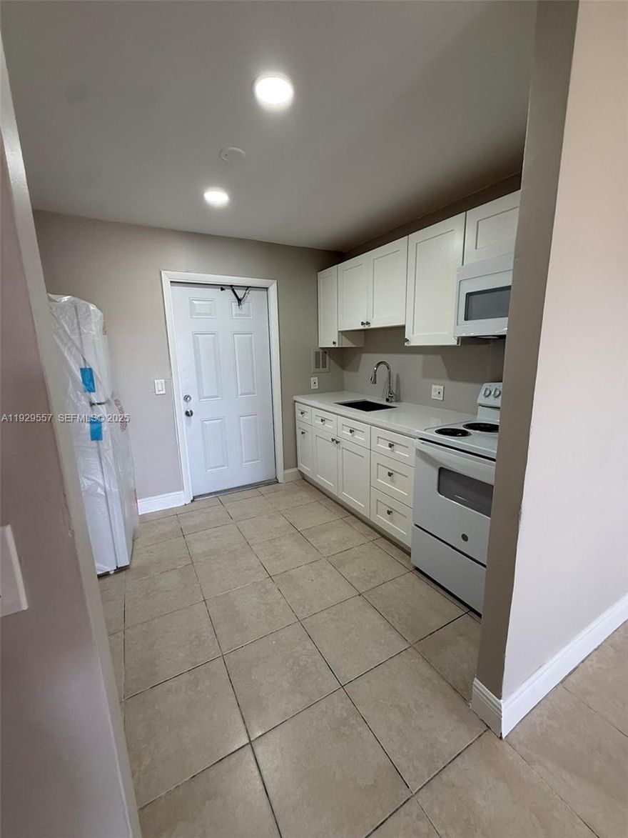 Beautifully remodeled and move-in ready 2-bedroom, 1-bath unit located in The Courtyards at Cimarron in Oakland Park. This home features all tile flooring throughout and a brand-new kitchen with granite countertops. Appliances included: refrigerator, electric range, and microwave.

The unit offers two separate entrances, providing added convenience and privacy.
HOA is only $332.02 per month, and the community is scheduled for a new roof and fresh exterior paint soon—adding even more value. CASH ONLY.
