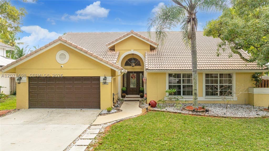 Photo of 7101 NW 44th Ln, Coconut Creek, FL 33073 (MLS # A12071698)