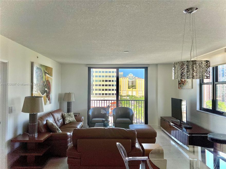 Move in ready! In the heart of Rosemary Square, downtown West Palm Beach, Cityplace an unbeatable location! Fully furnished, turnkey, bright and cozy 2 BED, 2 BATH, SE corner unit with lots of light and city views! A serene and quiet space. Features an open kitchen, granite countertops, wine cooler and stainless steel appliances. High gloss marbel floors throughout and split floor plan. In unit washer & dryer. Includes one assigned covered parking space ALL-NEW impact sliding doors and windows. Enjoy resort-style amenities: Valet parking. 24-hour doorman, pool, jacuzzi, courtyard, theatre room, fitness center, business center, club room, lounge area and on-site manager. Download Circuit app & ride free, you won't need a car!