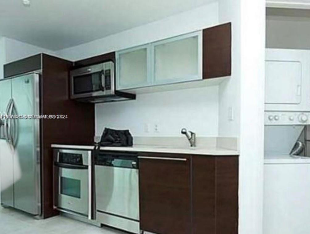 Upgraded studio at Quantum on the Bay with balcony showcasing stunning bay & skyline views. Features ceramic floors, walk-in closet, washer/dryer, and resort-style amenities: 2 pools, gym, lounges & movie room. Unit Rented until September 30th.