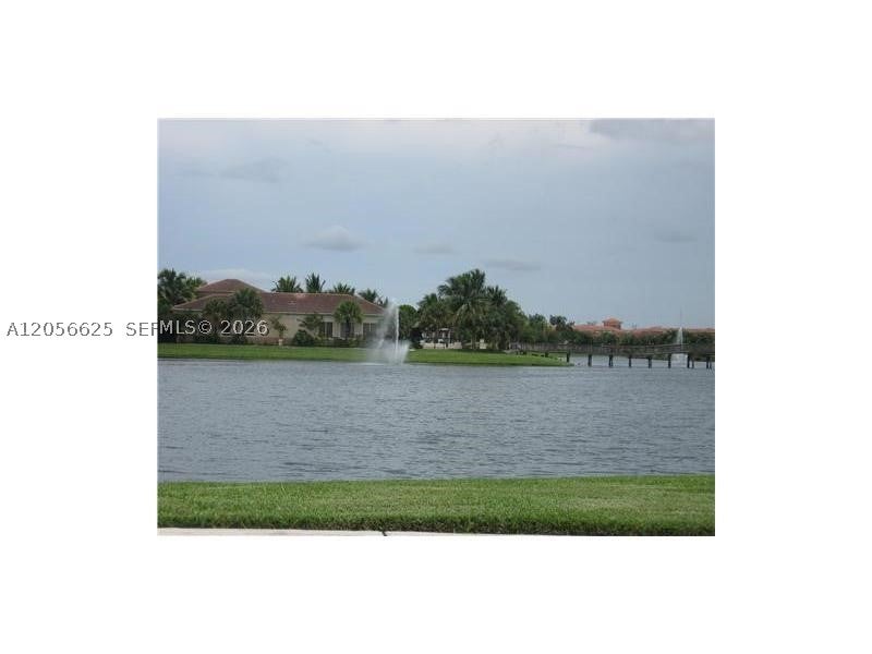 Photo of 2494 Centergate Dr #103, Miramar, FL 33025 (MLS # A12056625)