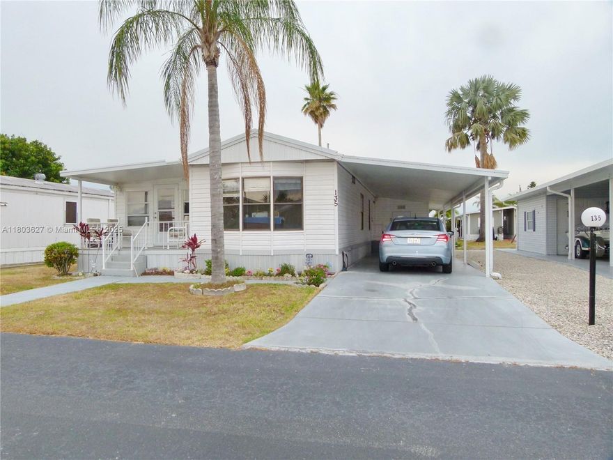 OASIS VILLAGE - 2/2, spacious living room, split floor plan, high ceilings, carport could hold a boat and a car, nice mancave, and a patio behind, golf cart stays. This is an active 55+ Community, always something to do, heated pool, pickleball, shuffleboard, billiards, and a clubhouse for all your social activities. This community is close to town and all shopping, doctors, etc.