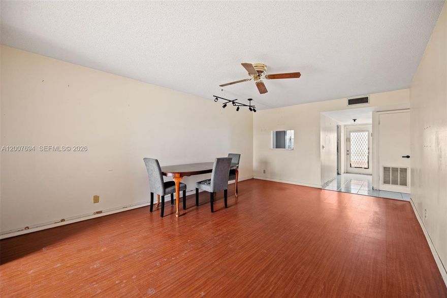 Start your day with tranquil lake views in this bright and spacious 2-bedroom, 2-bath condo. It includes an assigned parking space and offers comfortable living within a vibrant 55+ community. Opportunities priced well like this are hard to find. Enjoy an impressive selection of amenities including a clubhouse, fitness center, multiple pools, theater, ballrooms, library, tennis courts, and even a golf course. Priced to sell, this unit offers great bones and presents an excellent opportunity for a buyer to renovate, update, and truly make it their own. Ideally located just minutes from Sawgrass Mills Mall, with easy access to shopping, dining, and everyday conveniences—this is a fantastic value with tons of potential.