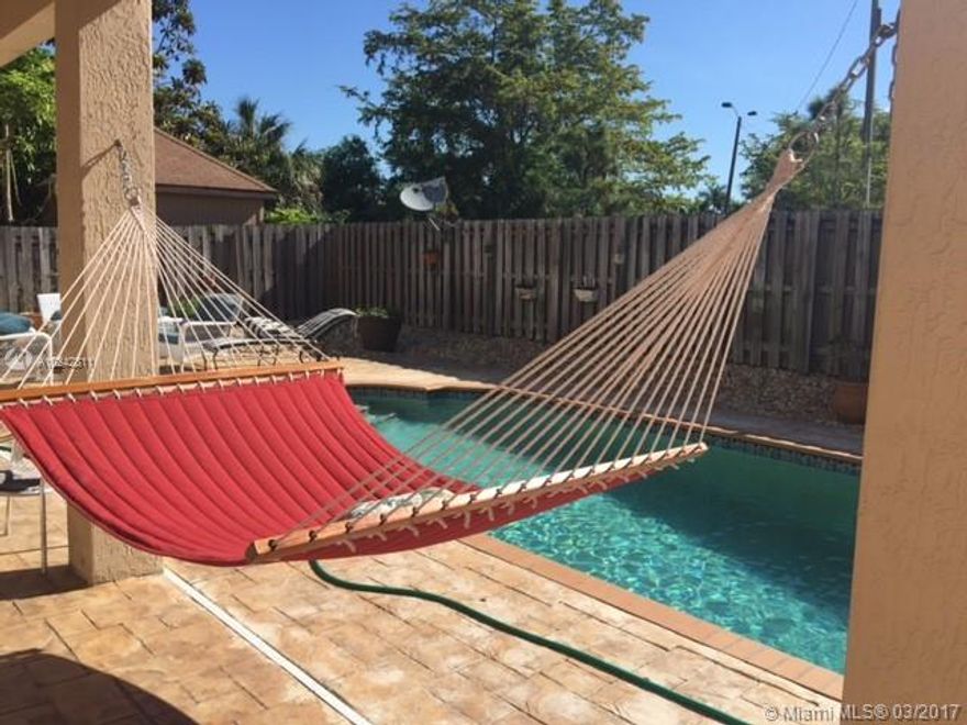 Amazing family home now available for rent. Unwind and relax in the comfort of your backyard.  This elegant and spacious home offers Living room, Dining Room, Family room equipped with surrounded sound and alar, two master rooms, one of them with a balcony, tile floor throughout and granite countertops.   Come see it today and make this house your new home.  Property has been repaired and recently painted.