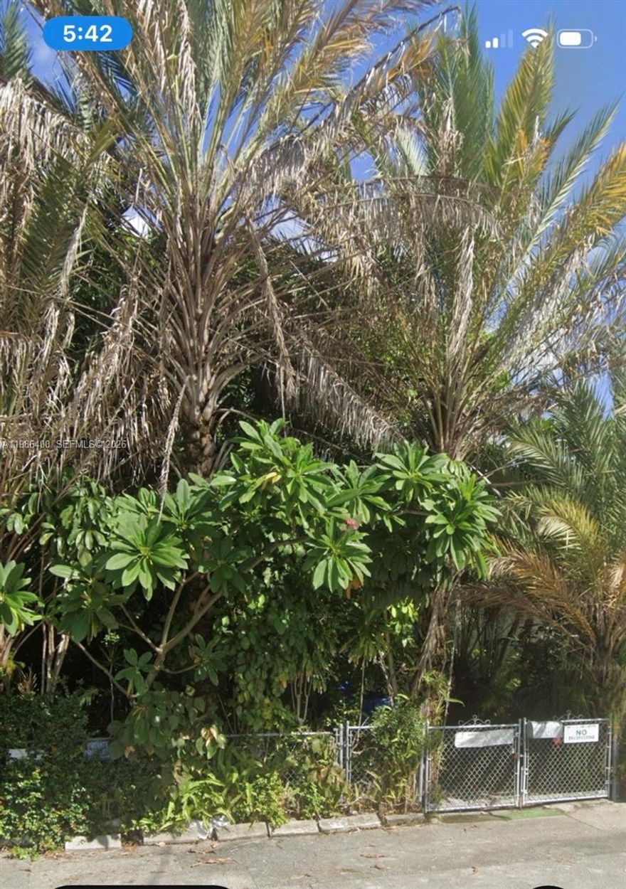 Located in the heart of the rapidly evolving LITTLE RIVER DISTRICT, this 8450 sq. ft. lot sits at the intersection of NE 69th St. and NE 4th Ave. making it an excellent choice for maximum visibility for your business. It currently has a small house with approx. 700 sq. ft. that could be renovated and leased.  It is surrounded by dense tropical palms and fruit trees with high privacy.  Great opportunity for development, warehouse, retail, office, production, etc.   First time on the market. Motivated Seller.  Call listing agent for further information and showing.  Susan Krutzler 321-663-0893