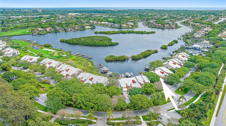 Welcome to your dream Harbor Home, with amazing views of the expansive waterways in Admirals Cove. This has been completely renovated with care, making sure there's plenty of space for everything you need - a living room to chill out, a family room for spending time together, a gorgeous bar area for drinks, a large kitchen for cooking, and 2 bedrooms, each with their own bathrooms .Right when you walk in, you'll find a big living room that's great for hanging out or having friends over. It leads into a family room where you can really relax and feel at home. The bar area is perfect for when you want to have a drink and chat.