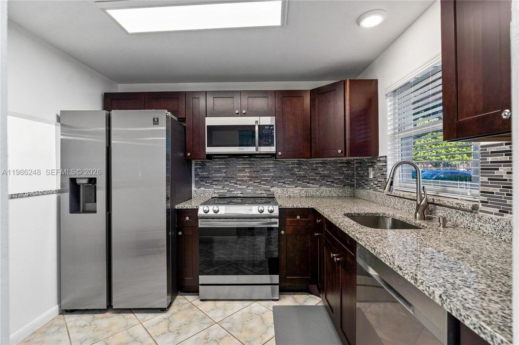 Photo of 9540 Sunrise Lakes Blvd #103, Sunrise, FL 33322 (MLS # A11986248)