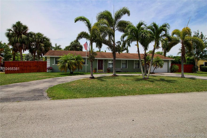 Well maintained pool home in quiet neighborhood. Large master bedroom with walk-in closet, and bathroom. Kitchen has granite counter tops and Italian tile. You will find strand bamboo floors in living area. Lots to offer with screened patio, hot tub, fenced yard, 2 sheds for storage and 2 car garage. Plenty of room for your boat or toys. Rain Bird sprinkler system for front and backyard. New roof after Hurricane Wilma. Fruit trees include, Mango, Fig, and Guava and Pergola for Orchids.