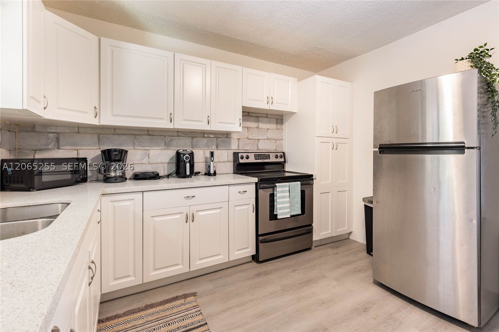 Photo of 20 SE 13th Ter, Dania Beach, FL 33004 (MLS # A12065255)