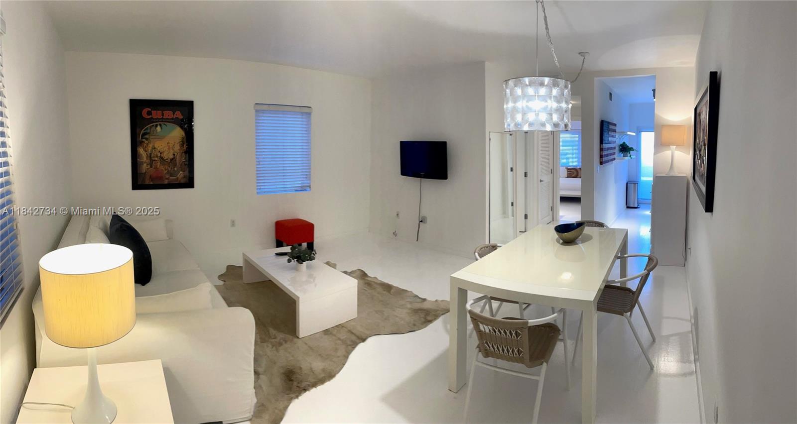 Elegant and private corner unit! This spacious 1-bedroom, 1-bathroom residence offers 730 sq. ft. of living space. Fully furnished with wood flooring, a newly renovated kitchen and bathroom, and an in-unit washer and dryer. Located at the rear of a well-maintained Art Deco building, the unit provides added privacy and a charming courtyard sitting area.