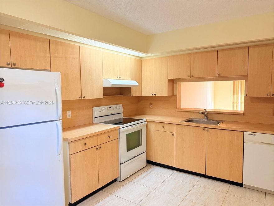 SPACIOUS 2 BED / 2 BATH CONDO with in-unit laundry, located on the first floor of the highly desirable Century Village 55+ community in Pembroke Pines. Features tile and carpet flooring and a large screened-in patio with peaceful garden views. Assigned parking conveniently located near the building. Enjoy resort-style amenities including clubhouse, fitness center, multiple pools, tennis courts, transportation services, and more. Association fee includes water, cable, internet, and full access to community amenities. Association approval required. Minimum 650 credit score. At least one occupant must be 55+. No pets per HOA.