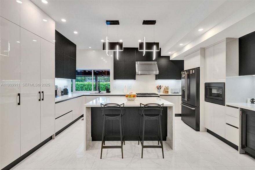 Custom SKYLAKE showplace, designed by renowned mid-century architect Barry Sugarman. This true 5-bedroom,3-bath residence has been completely renovated, featuring soaring 10-foot ceilings that fill the home with light and space. Elegant white porcelain floors, a new gourmet kitchen with gas stove and outdoor gas BBQ, updated baths, impact windows & impact glass doors, and a new pool with hurricane- impact shade for added protection. The split bedroom layout offers privacy, with all closets built-in. Additional features include a whole-house generator,French drains for super drainage, exterior lighting and lush landscaping. Nestled on a quiet, tree-lined street in Skylake, near Brightline, schools,houses of worship and Aventura Mall. Move-in ready- just bring your personal belongings.