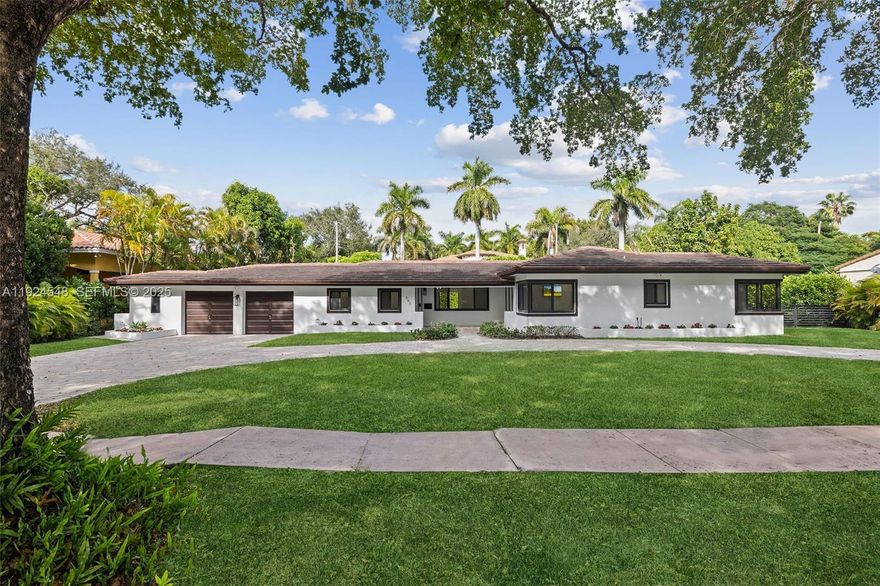 Experience exceptional living in the Golden Triangle of Coral Gables! This lovely home features 3 bedrooms, 3 baths, and a versatile 4th room that can serve as a bedroom, office, or playroom. An oversized 2-car garage, indoor laundry room, and a spacious circular driveway add convenience. Enjoy outdoor entertaining with a covered terrace, complete with an outdoor cook prep area with sink, ice maker, and wine and beverage refrigerator. Elegant patio furniture included. Relax by the oversized saltwater pool or play soccer or throw the ball around in the large yard with mango, avocado and guava trees. Home has impact doors and windows, an alarm system, and exterior Ring cameras. Three mounted TVs are included for your enjoyment. This home is available for lease—experience Coral Gables living at its best!  A Very Special Home.