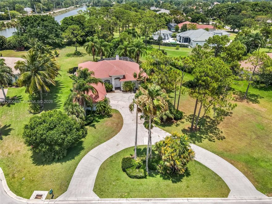 Experience refined living in the prestigious gated enclave of Bayhill Estates, located within the renowned PGA golf course community, which is currently being beautifully revitalized and enhanced. This completely furnished 4-bedroom, 3-bath residence is set on a sprawling one-acre lot in a quiet and private neighborhood, offering the perfect blend of elegance, comfort, and space. Inside, the home features soaring volume ceilings, an excellent split floor plan, and generously sized living areas designed for both everyday living and entertaining. The spacious driveway and 3-car garage provide both convenience and impressive curb appeal.

Step outside to your own private oasis, where a large screened pool and spa create the ideal setting for relaxing or hosting guests while enjoying peaceful golf course views. Surrounded by lush landscaping and situated on a quiet cul-de-sac, this property offers a sense of serenity that is hard to find. Residents also have the opportunity to enjoy membership at PGA National, adding access to an exceptional lifestyle centered around golf, leisure, and resort-style amenities. This is a rare opportunity to own a beautifully furnished home in one of the area’s most desirable and evolving luxury communitie!