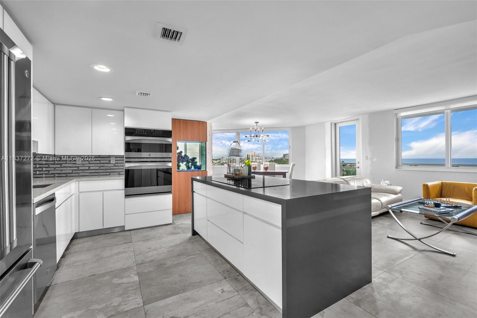 Come, live where people vacation! Upon entering this 2/2 unit with 1455 sqft your eyes quickly become immersed to the stunning blues hues from the Ocean. Owner spared no expense on this remodel, with concrete looking porcelain tile, an open kitchen & a large cooking island that faces the Ocean! Both bathrooms have been tastefully remodeled, as you walk through both bedrooms you will also enjoy Ocean views. Located in the most desirable line in the building, within walking distance to so many outdoor activities. Enjoy entertainment from the Bandshell where many concerts are performed, walk around the park, play Beach Tennis, walk the boardwalk or lay out, relax and enjoy the Ocean. Within walking distance to many great restaurants, grocery, public, pharmacy and North Shore Community Center.