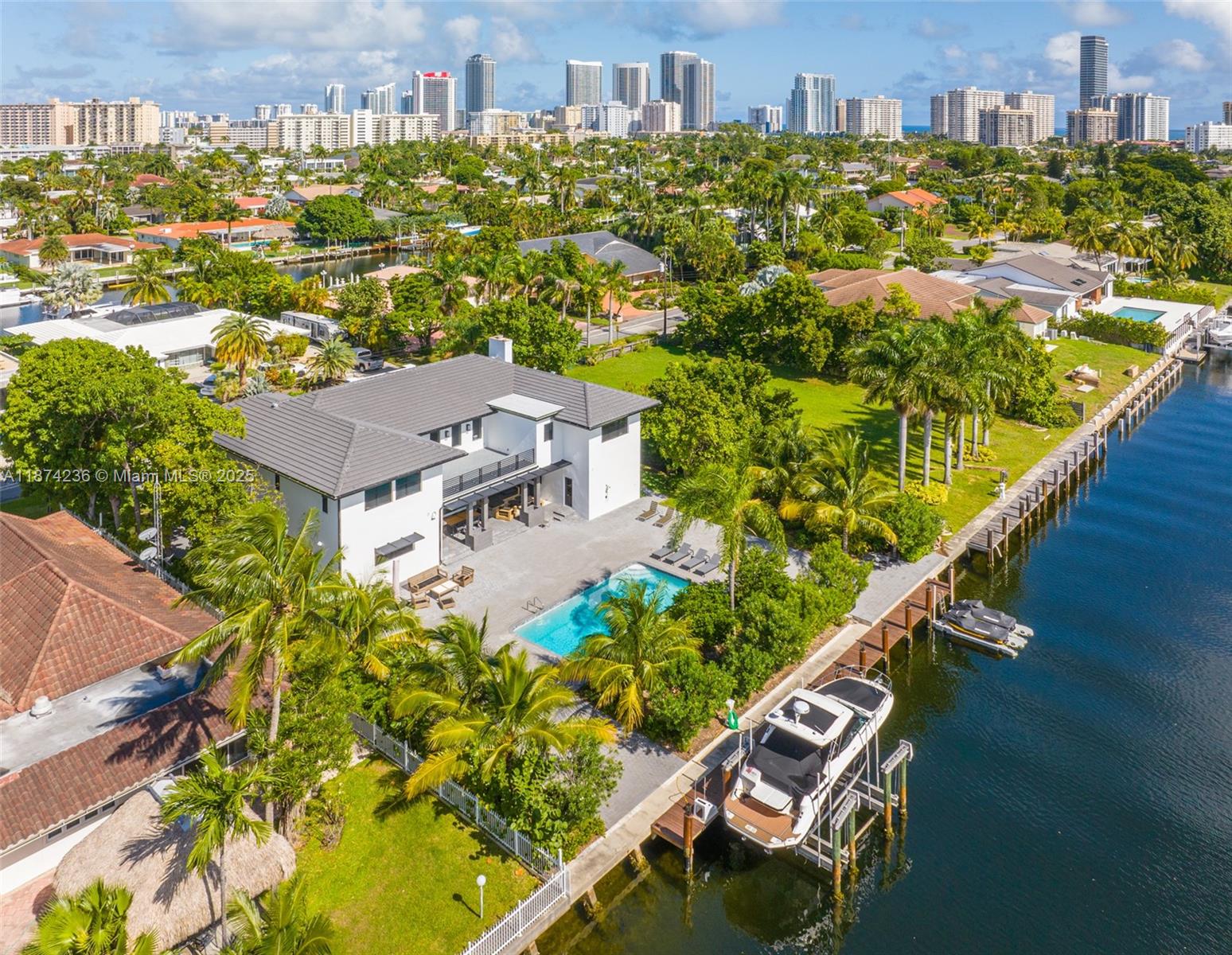 Contemporary Waterfront Estate. Impressive 110ft of waterfront/dockage on deep-water ideal for large vessels (110’ x150’ lot size). Situated in the gated Golden Isles waterfront community with southern exposure backyard on wide canal on one of the best streets in the community. Features include: 6BR/6.5BA, office, formal dining room, wet bar, wine cellar, oversized entertainer’s kitchen and motorized blinds. Enjoy the South Florida weather year-round with outdoor summer kitchen, large backyard, pool, deeded dock, boatlift, ocean access, batter pile seawall, deep water and no fixed bridges to the ocean. Centrally located between Miami-Dade and Fort Lauderdale and close to shops, restaurants, beaches and more. Great opportunity to live on the water.